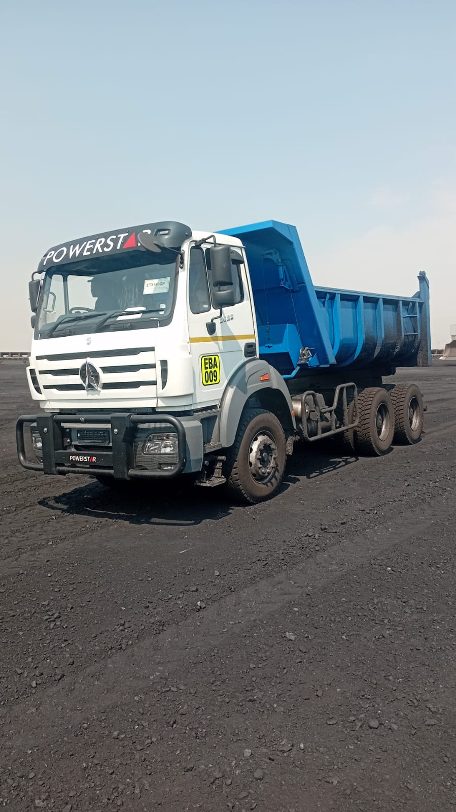 Powerstar dump truck loaded and working